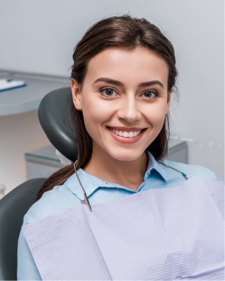 Young woman smiling in orthodontic treatment chair