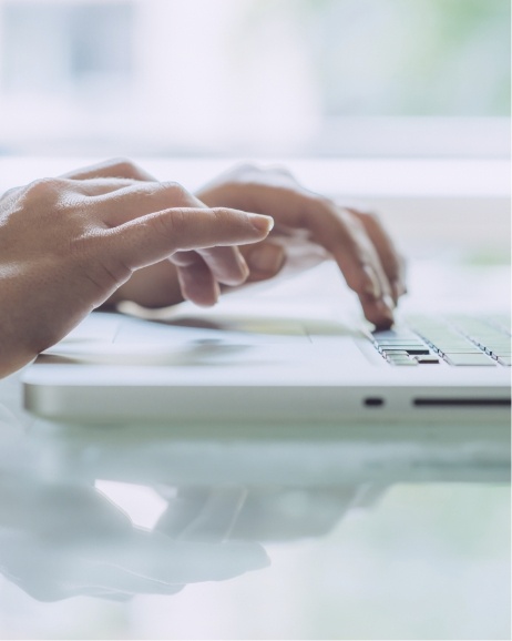 Person typing on laptop