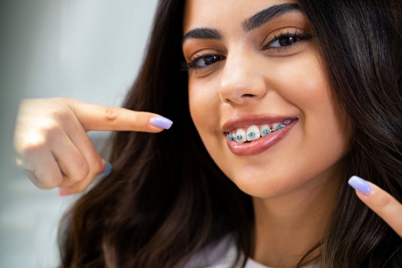 A cute and smiling woman with braces